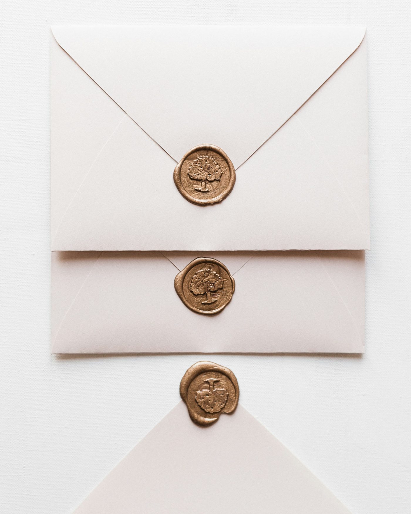 Ivory envelopes closed with bronze wax seals